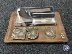 A vintage leather correspondence case together with three glass inkwells and a collection of