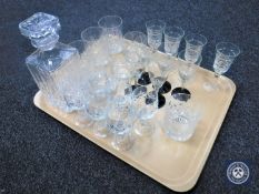 A tray containing assorted glass ware together with a whisky decanter