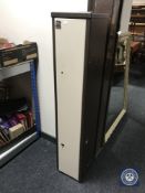 A metal gun cabinet with key
