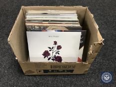 A box containing LP's to include White Snake, Elvis Costello,