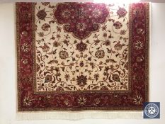 A Keshan rug on beige ground,