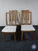 Four contemporary rail back kitchen chairs