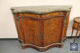 An ormolu mounted serpentine fronted marble topped credenza,