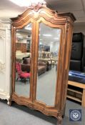 A French walnut double mirror door armoire CONDITION REPORT: Losses to pediment.
