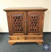 An Eastern mahogany entertainment cabinet