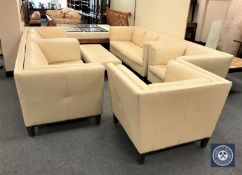 A cream leather six-piece lounge suite comprising three seater settee, pair of two seater settees,