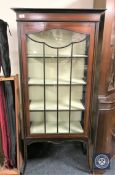 An Edwardian inlaid mahogany display cabinet