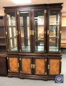 An oriental style four door break front display cabinet