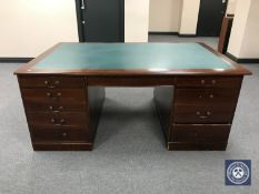 A mahogany partner's desk with inset panel