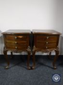 A pair of French style three drawer bedside tables