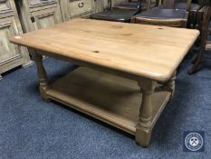 A pine two tier coffee table