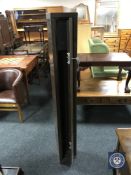 A metal gun cabinet with key