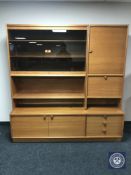 A Turnidge of London teak display unit