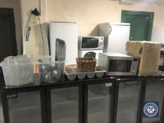 A stainless steel microwave, box and two tubs of plastic bain marie pots, cooking utensils, pans,