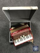 A Hohner Arietta IM accordion in case