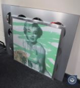 Two framed sectional mirrors and a pop art poster