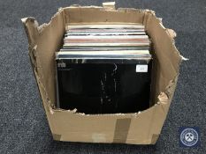 A box containing LP's to include The Clash etc