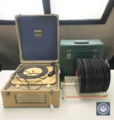 A mid 20th century Dansette Minor table top record player together with a rack of 78 records and a