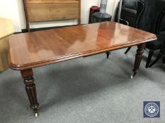 A Victorian mahogany wind out dining table