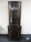 A mahogany corner display cabinet