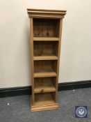 A set of narrow pine open shelves