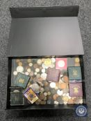 A box containing pre-decimal British coinage,