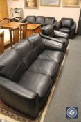 A black leather four piece lounge suite : pair of three seater settees and pair of chairs (4)