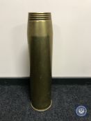 A large brass ammunition shell