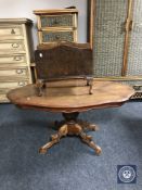 A shaped Italian style coffee table and a walnut magazine rack