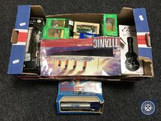 A box containing a scale model of Titanic, Tetley Tea folks, Altas Guitars of the Stars,