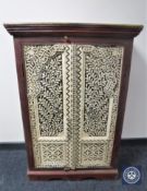 A painted hardwood Eastern style double door cabinet CONDITION REPORT: 114cm high