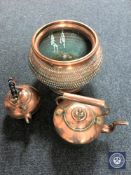Two copper kettles and a large copper planter