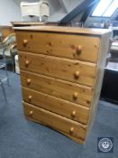 A pine five drawer chest