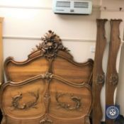 A carved walnut French bed frame