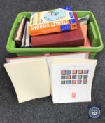 A box containing a large quantity of stamps and first day covers in albums