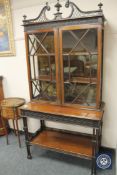 A 19th century Chippendale style mahogany cabinet on stand,