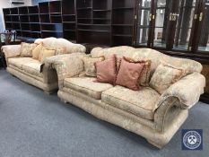 A pair of Medallion two seater settees in an Indian print with scatter cushions