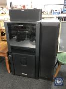 A Sony hifi system in cabinet with sub woofer speaker and five surround sound speakers