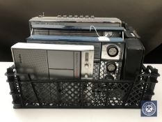 A basket of four assorted radios to include; General Electric Co.