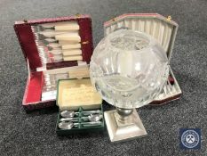 Three boxes of cutlery together with a glass and silver plated candle holder.