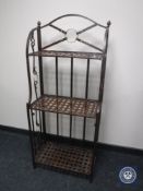 A folding metal three tier shelving unit