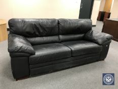 A black leather two seater settee