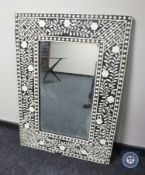 A mosaic framed mirror