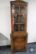 A walnut corner display cabinet