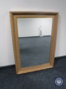 A gilt framed Victorian style overmantel mirror