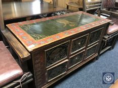 A painted Chinese style low cupboard fitted two drawers