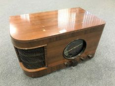 An R.G.D. walnut cased valve radio.