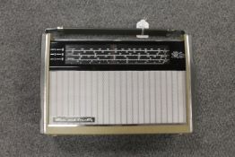 A Perdio transistor radio.
