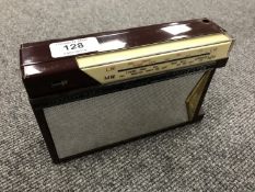 A Fidelity radio, Floret transistor, Burgundy.