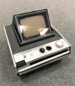 A National Solid State portable TV radio.